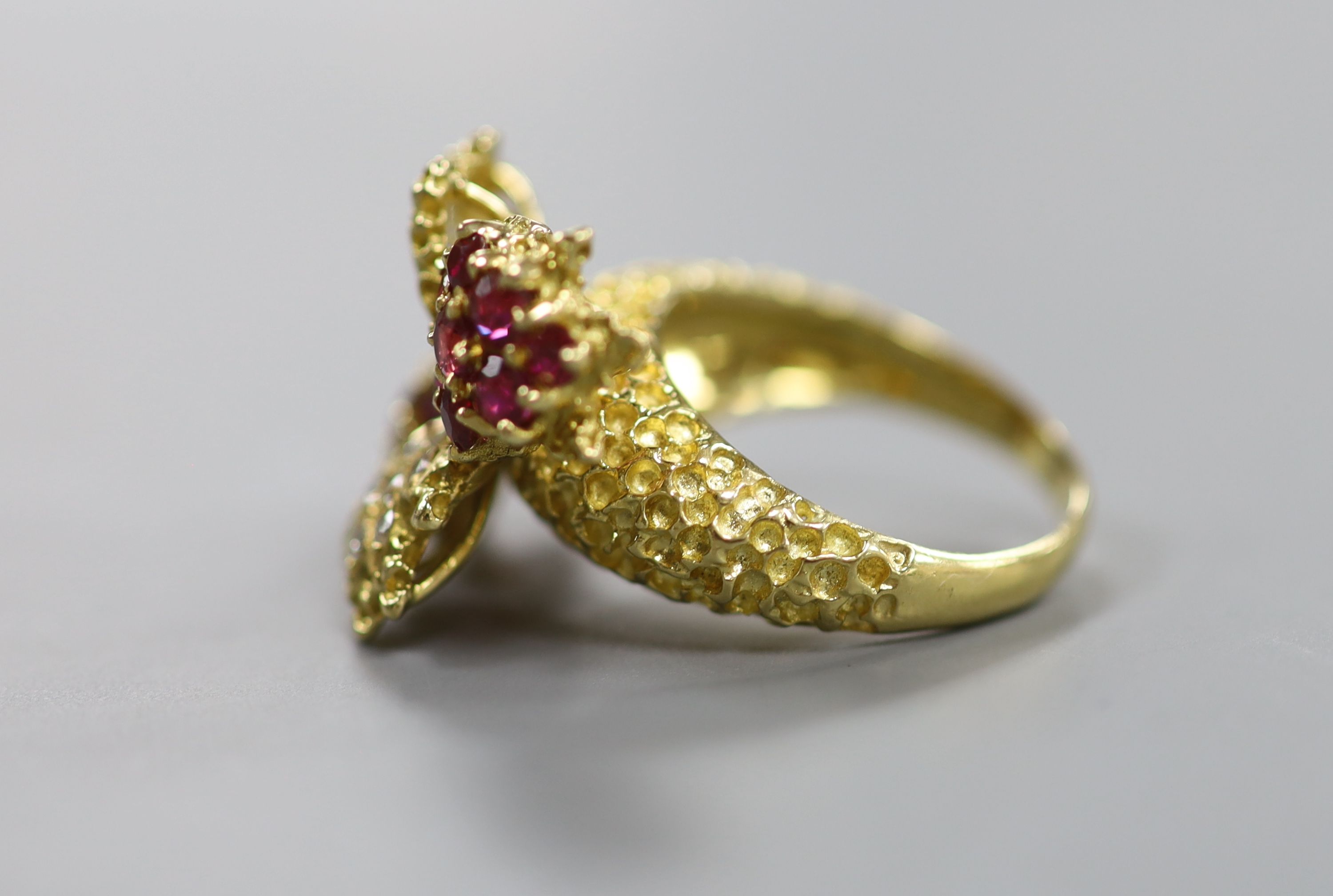 A 1970's 18ct gold, ruby and diamond quadruple cluster dress ring, by Ben Rosenfeld